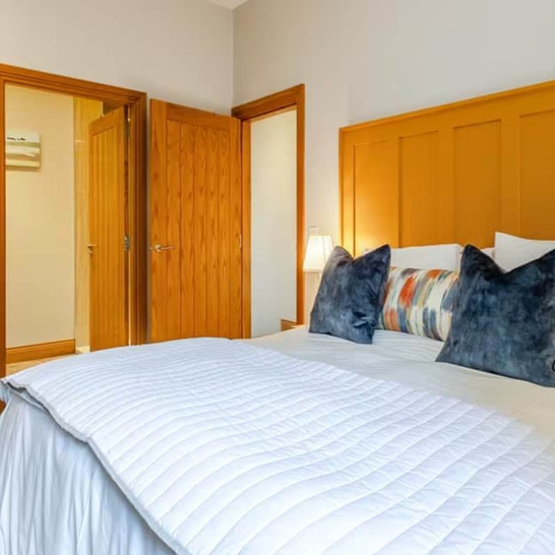 A cosy double bedroom in The Smithy accommodation at Woodside in Fife