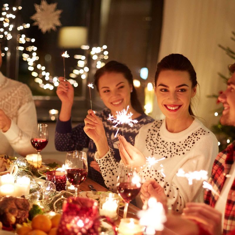 A group of people enjoying Christmas dinner