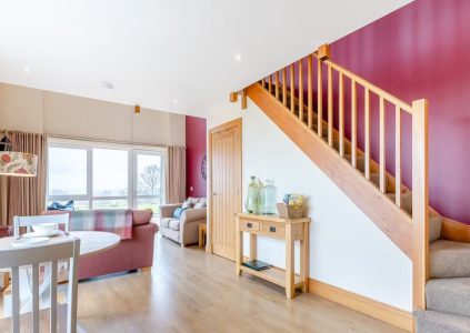 The open plan living and stairs in The Granary accommodation at Woodside in Fife