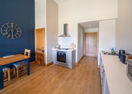 The kitchen and dining area in The Byre accommodation at Woodside in Fife