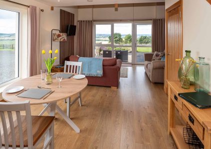 The open plan living and dining in The Granary accommodation at Woodside in Fife