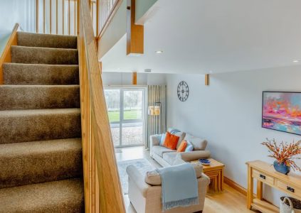 The open living and stairs in The Hayloft accommodation at Woodside in Fife