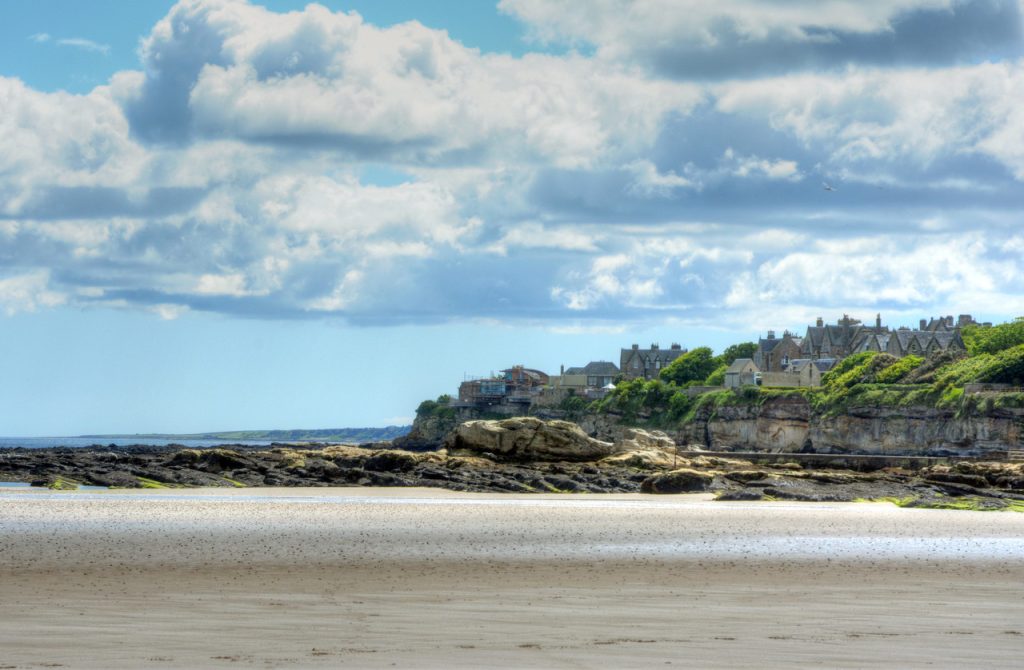 A view of west sands beach with St Andrews Castle in the background
