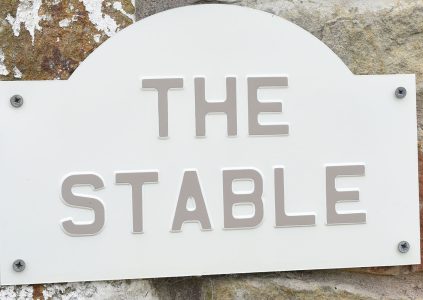 The Stables accommodation sign at Woodside in Fife