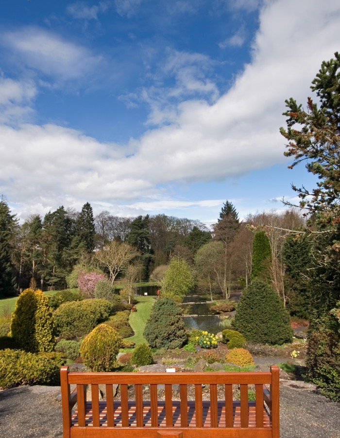 A bench overlooking the botanic garden in St Andrews in Fife, Scotland.